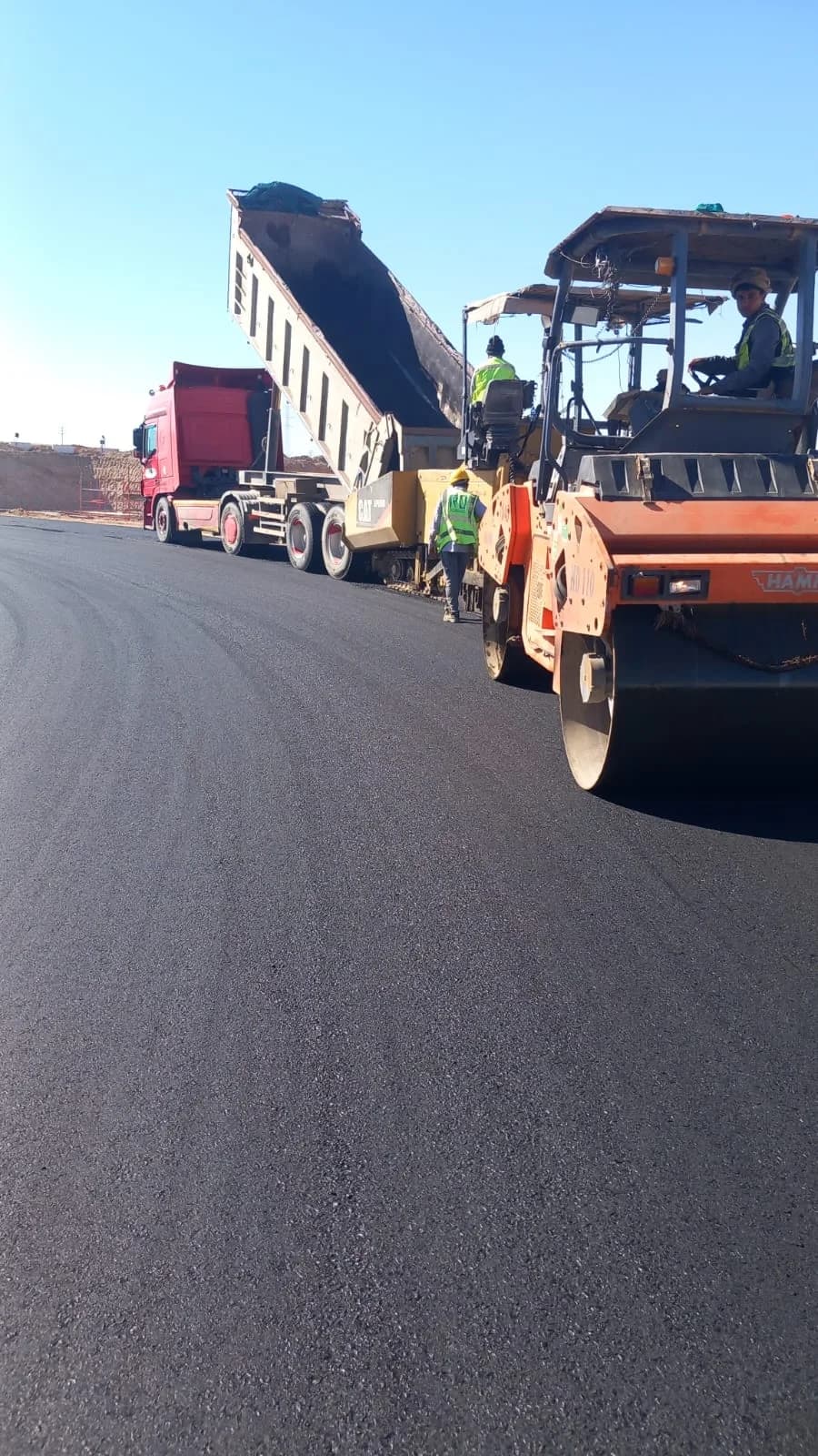 Asphalt paving operation on a NEOM road infrastructure project for Petrojet Company Saudi Arabia Inco.
